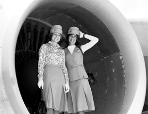 Ladies posing in front of turbine