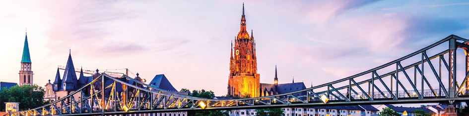 View of bridge and city of Frankfurt at sunset