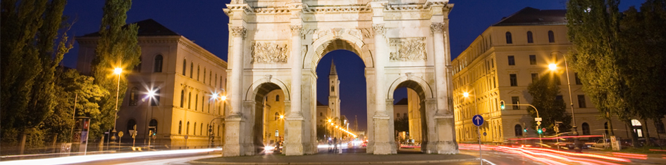 Street view of buildings in Munich at night