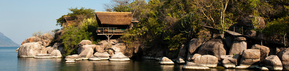 Cabin on the rocks next to lake